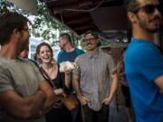 Customers wait in line for Egyptian food at a cart in Portland.