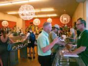 Justin Runquist/The Columbian
Customers visit Vancouver recreational pot shop Main Street Marijuana on July 1, the day recreational marijuana became legal in Oregon.