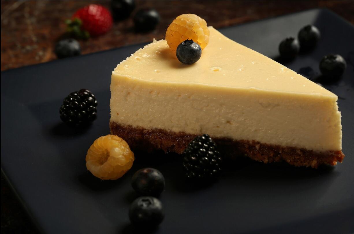 Fresh, plain goat cheese brings a subtle tang and dense texture to a creamy, soft cheesecake, a perfect partner for summer berries.