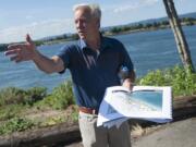 Barry Cain, president of Tualatin-based Gramor Development, leads a group on a tour of the Vancouver waterfront in July.