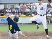 Cowlitz Black Bears shortstop Seaver Whalen, a Union High graduate, gets a foot on the bag in time to retire Kitsap's Jeffery Bohling during a West Coast League game this summer at David Story Field in Longview.