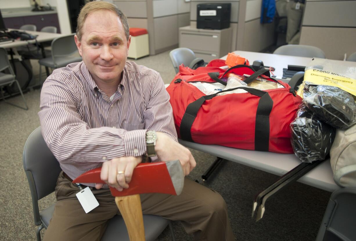 Scott Johnson, the emergency management division manager with the Clark Regional Emergency Services Agency, has compiled an earthquake survival kit. Johnson says that when disaster strikes, the community will work together to survive.