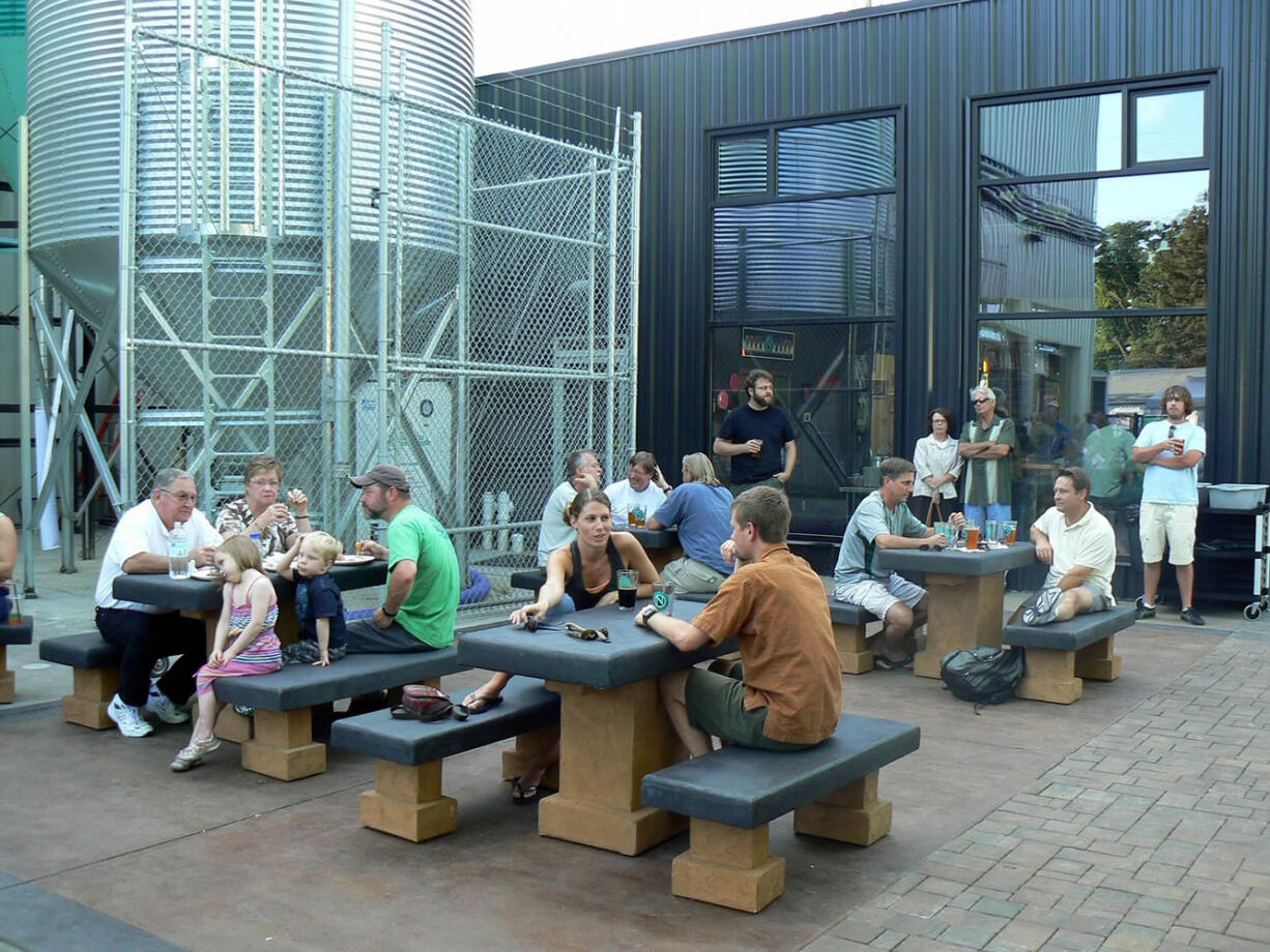 Diners enjoy the courtyard at Ninkasi Brewing in Eugene, Ore.