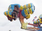 Carnival rides, including Energy Storm, will spin, turn, twist and drop riders who are brave enough to board.