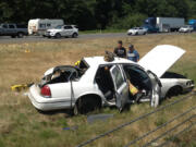 A car left interstate 5 south and rolled several times, landing in the grassy median near the northbound lanes.