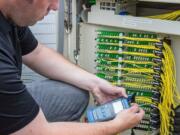 CenturyLink
A CenturyLink technician tests light levels at a fiber cross connect box that feeds residential and business customers with speeds of up to 1GB.