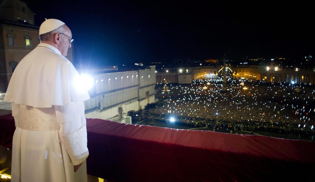 L'Osservatore Romano
Pope Francis looks at the crowd from the central balcony of St. Peter's Basilica at the Vatican in his first public appearance as pope on March 13, 2013.