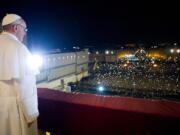 L'Osservatore Romano
Pope Francis looks at the crowd from the central balcony of St. Peter's Basilica at the Vatican in his first public appearance as pope on March 13, 2013.