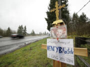 Motorists drive past a memorial for 6-year-old Henry Babitzke on March 6. He was killed in a collision on Interstate 5 on Feb.