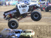 One of the monster trucks performs Sunday at the Clark County Fair.