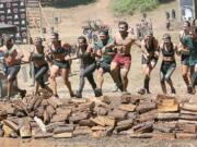 A team of Spartans takes the plunge into muddy water and then crosses the finish line together Saturday, at Washougal Motocross Park.