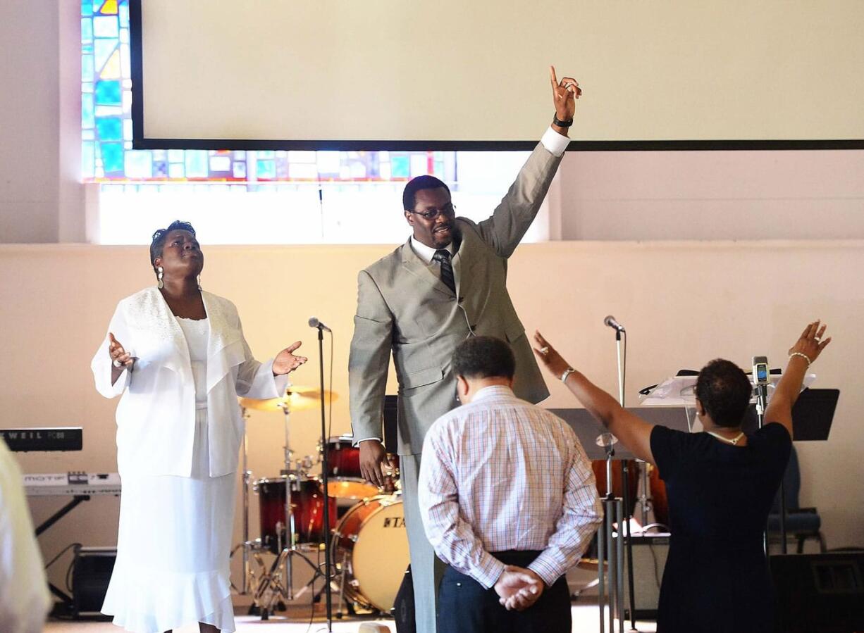 Co-pastor Rhonda Kinsey, left, and her husband, senior pastor Mannix Kinsey, lead the congregation during the 11 a.m. Sunday service at Briar Creek Road Baptist Church on June 28 in Charlotte, N.C.