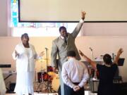 Co-pastor Rhonda Kinsey, left, and her husband, senior pastor Mannix Kinsey, lead the congregation during the 11 a.m. Sunday service at Briar Creek Road Baptist Church on June 28 in Charlotte, N.C.