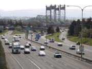 Traffic moves along I-5 near the Interstate Bridge, seen from the Evergreen Boulevard overpass.