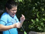 Ariane Kunze/The Columbian files
Carlos Fuerte, 10, gets a surprise spray in the face at the Esther Short Park fountain on a 101-degree day in July. This summer may break a record for days with high temperatures exceeding 90 degrees, but unlike Portland, our record streak is longer.