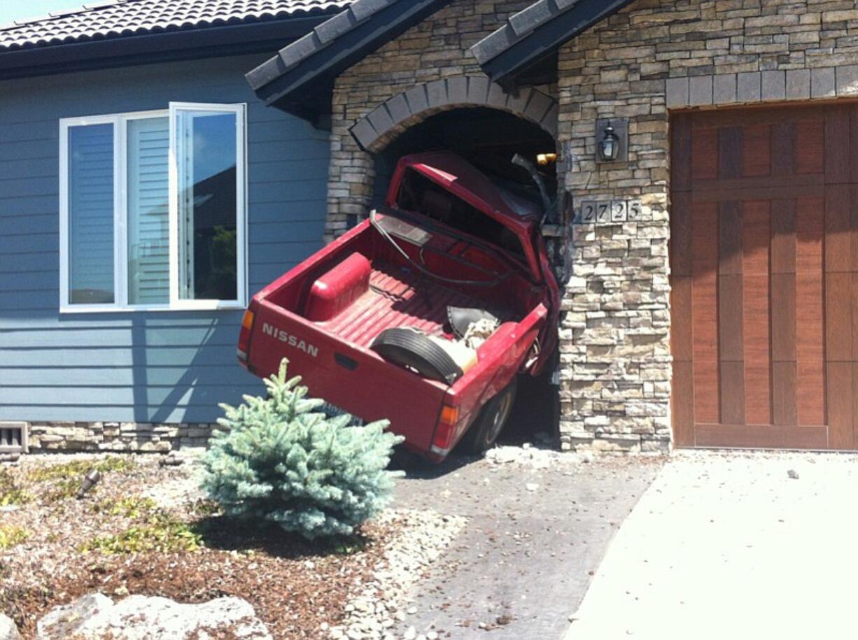 A red Nissan pickup crashed into the front door of a house in Camas's Prune Hill neighborhood on June 15. The driver of the pickup, Shayn M.