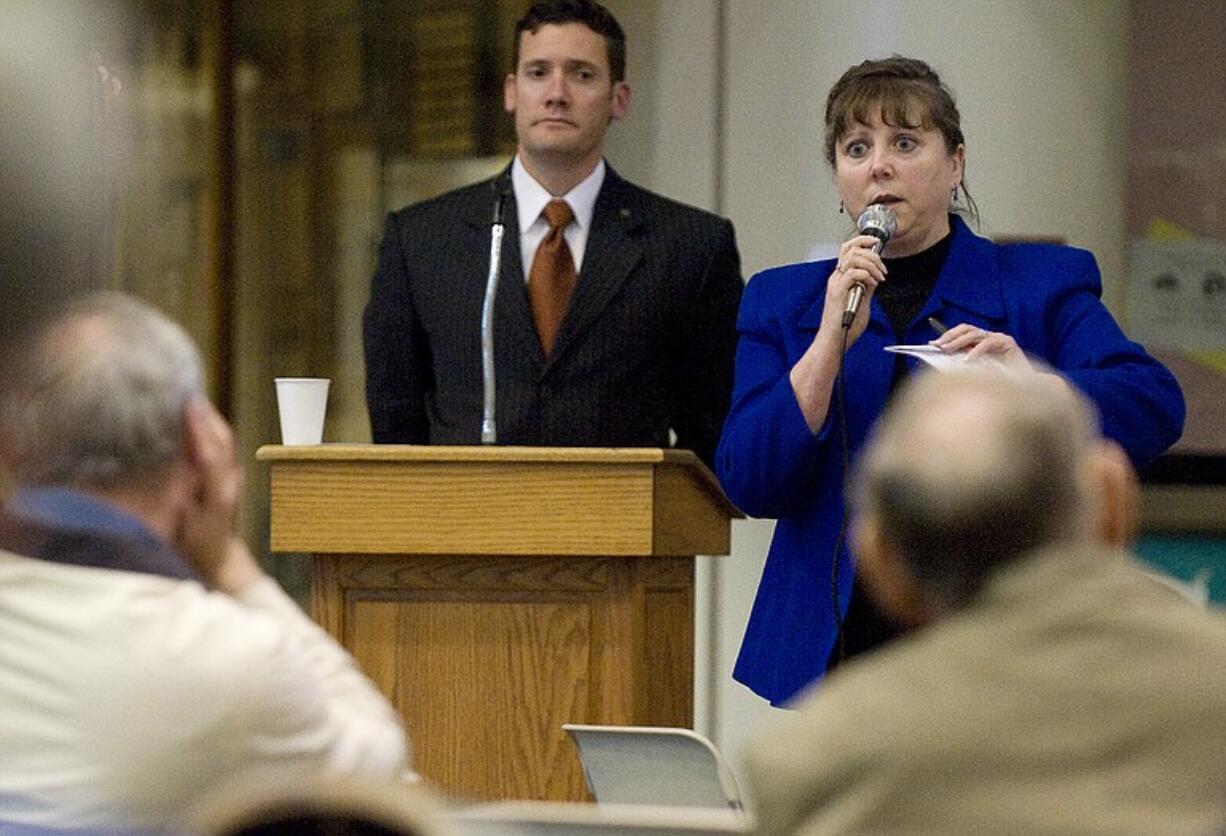 Vancouver City Council member Jeanne Harris, right, speaks at a town hall meeting in April.