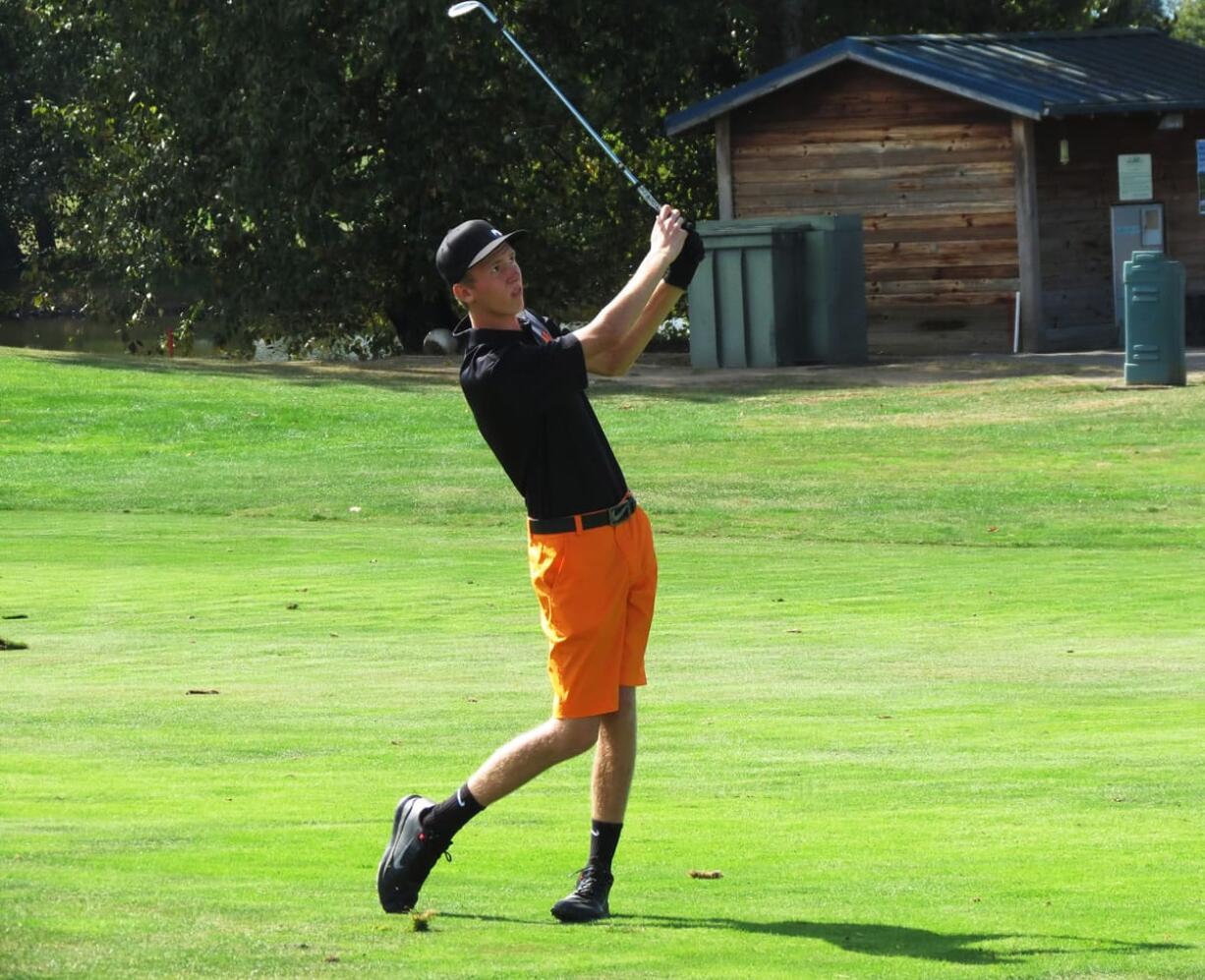 Bryce Samwel watches his approach shot land about a foot away from the 18th hole.