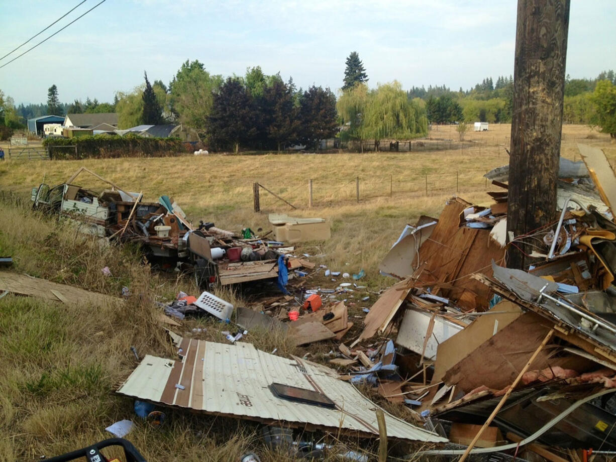 Tim Dawdy/Clark County Fire 
A motor home hit a power pole Tuesday evening off Northeast 10th Avenue south of Ridgefield. A woman inside was seriously injured and a man sustained minor injuries.