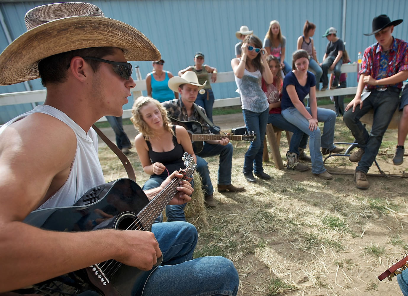 TJ Noble picks a little country during down time at the camp.