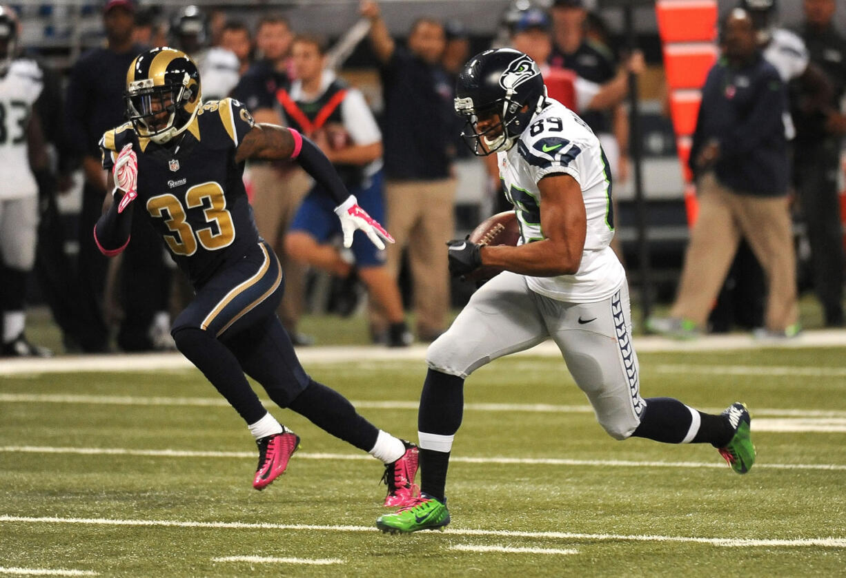 Seattle Seahawks wide receiver Doug Baldwin, right, slips past St. Louis cornerback E.J. Gaines after catching a pass for a 49-yard gain during the first quarter of an NFL football game Sunday, Oct. 19, 2014, in St. Louis. (AP Photo/L.G.