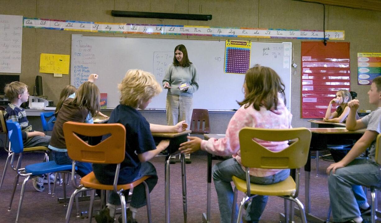 Cara Ramsey speaks to her 4th-and-5th-grade class before reading to them at Mount Pleasant  School in Cape Horn  in October  2008.