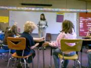 Cara Ramsey speaks to her 4th-and-5th-grade class before reading to them at Mount Pleasant  School in Cape Horn  in October  2008.