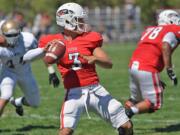 Southern Oregon University quarterback Austin Dodge (3) holds the NAIA all-time records for passing yardage and touchdown passes.