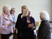 Members of Barat College's class of 1964, including Cathy Gibson, right, laughing with Lucy Naphin, far right, enjoy their 50th reunion Sept.