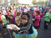 Runners prepare for the start of the seventh annual Girlfriends Half Marathon -- now named Girlfriends Run for a Cure -- on a chilly morning in October 2013.