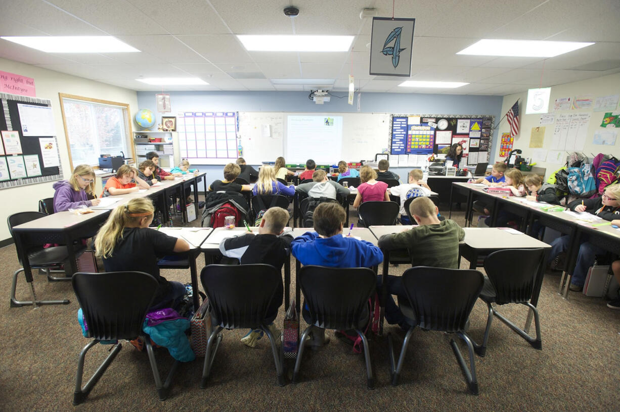 Daybreak Middle School students work in their classroom in a portable building with 10 classrooms. Hundreds of new homes are being built in the Battle Ground Public Schools district, and 1,080 new students are projected in the next 18 to 24 months.