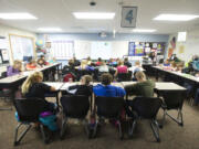 Daybreak Middle School students work in their classroom in a portable building with 10 classrooms. Hundreds of new homes are being built in the Battle Ground Public Schools district, and 1,080 new students are projected in the next 18 to 24 months.