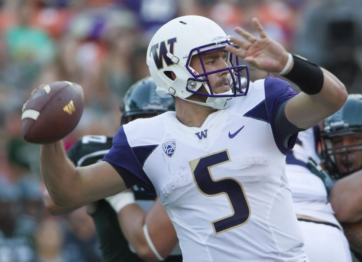 Associated Press files
Washington quarterback Jeff Lindquist during a 2014 game at Hawaii.