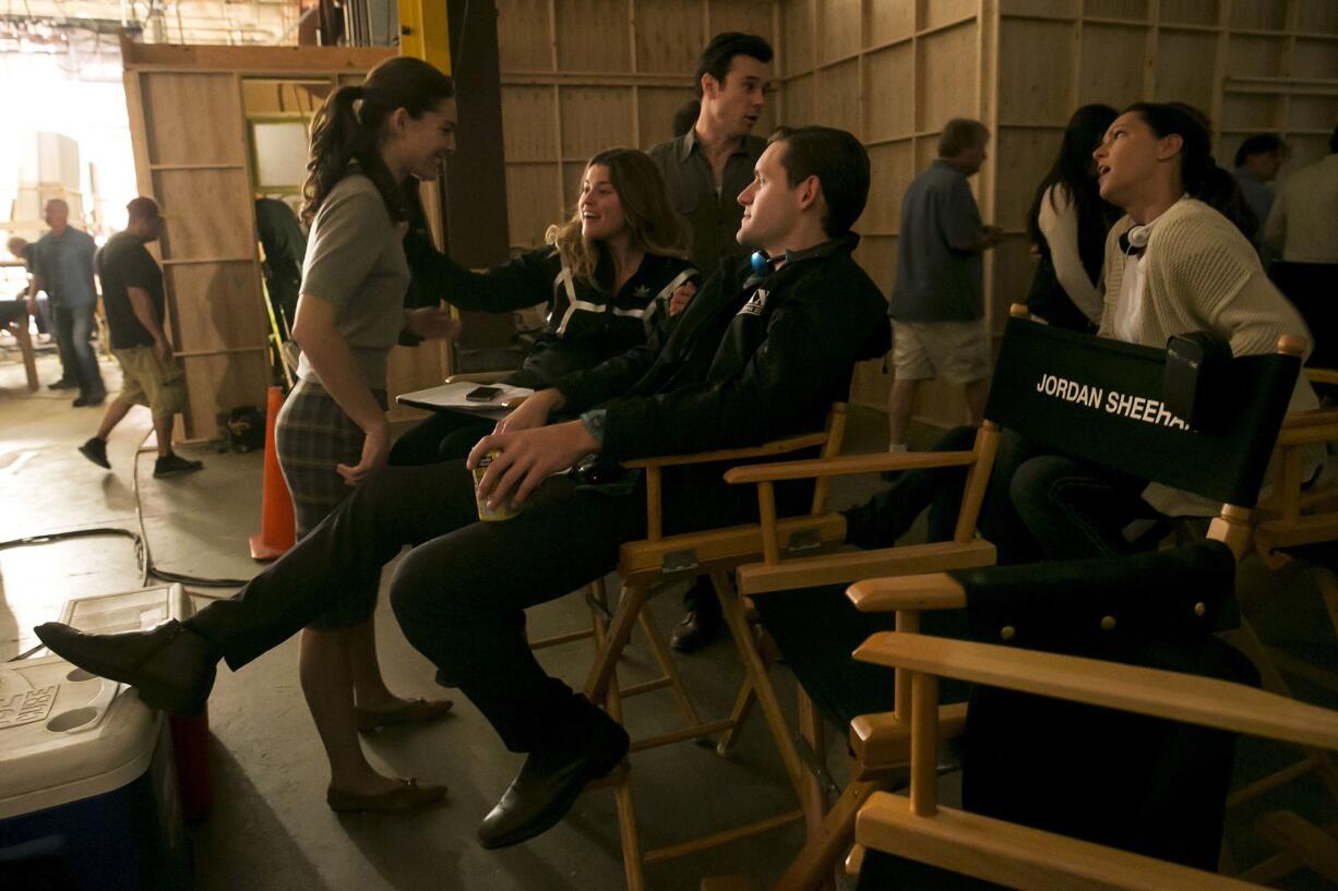 Actress Alexa Davalos talks with co-executive producer Jordan Sheehan and actor Luke Kleintank.