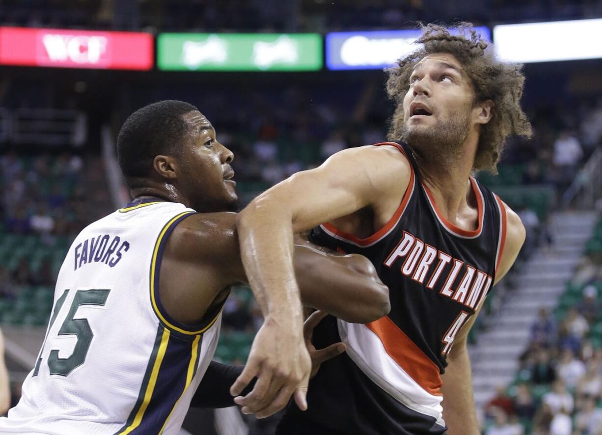 Portland's Robin Lopez takes up space in the paint, which allows him to set screens for shooters and get easy baskets from offensive rebounds.