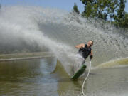 Scott Thompson and his daughter Erika Bolliger slalom water ski together on Mint Lake in Yacolt.