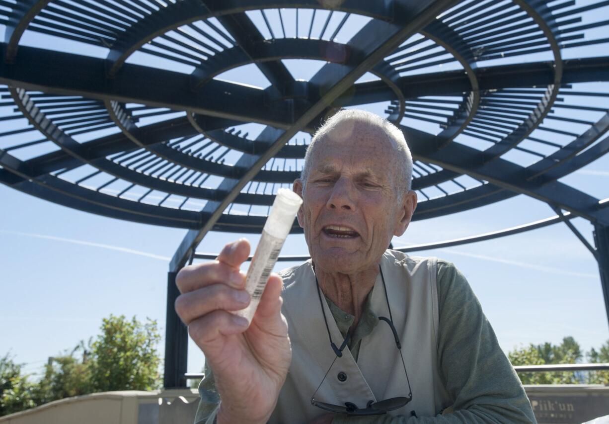 Vancouver resident Roland &quot;Em&quot; Emetaz picks up trash during a recent sweep of the Vancouver Land Bridge, one of his many volunteer activities. The 82-year-old is receiving a service award from the U.S.