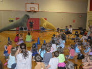 Washougal: Oregon Coast Aquarium staff members show kids and parents inflatable seals and sea lions during a visit Thursday to Hathaway Elementary School.