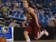 Prairie's Lauren Goecke chases a ball that got away from her in the first half of their second round game against Holy Names at the state basketball tournament at the Tacoma Dome on Thursday March 11, 2010. Holy Names won the game 62-36.