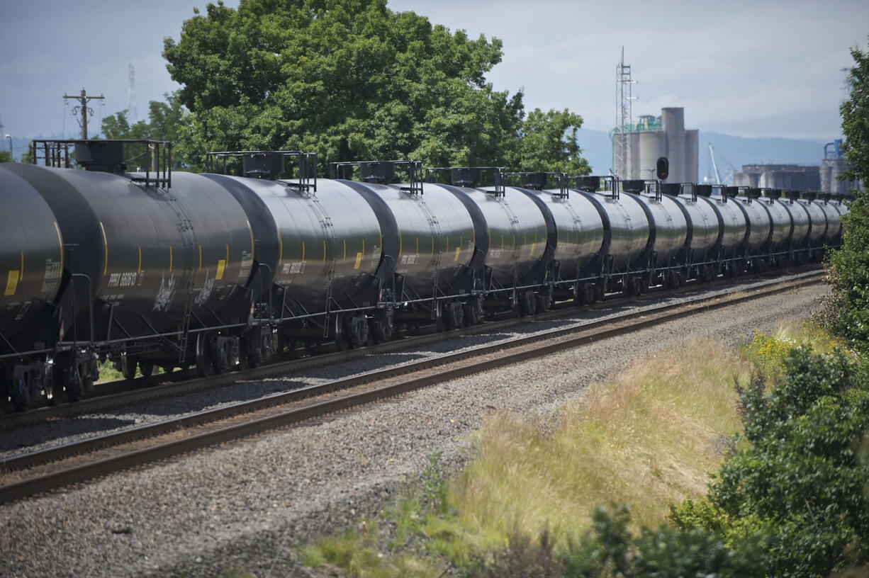 An oil train passes the Vancouver Land Bridge.