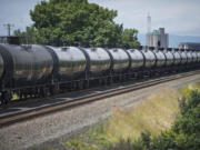 An oil train passes the Vancouver Land Bridge.