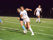 Ridgefield's Taryn Ries (3) is chased by Hockinson's Sophia Niehaus during the 2A District 4 championship soccer match Thursday at Ridgefield High School.