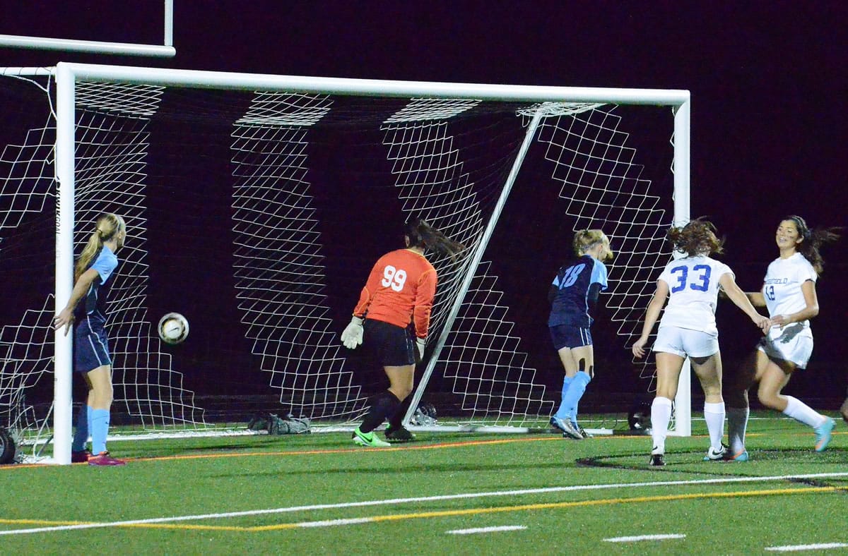 Erin Siegel, right, reacts after scoring Ridgefield's first goal against Hockinson on Thursday at Ridgefield High School.