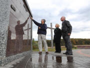 Hopewell United Methodist Church Senior Pastor Steve Morton, left, Debra Boyd, director of lay ministries, and Pastor Dan Hepner examine the name plates on one of the newly constructed columbaria Oct.