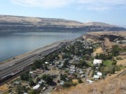 The town of Wishram along the Columbia River, with the railroad bridge linking Oregon and Washington in the background.