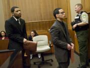 Co-defendants Brandon English, left, and Calvin Quichocho are led out of Judge Barbra Johnson's courtroom during an earlier court appearance in October.