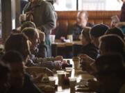 Guests visit Chronis' Restaurant and Lounge for the annual free Thanksgiving meal in November 2013.