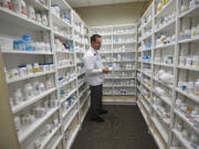 Pharmacist Patrick Gallaher works inside The Vancouver Clinic at Columbia Tech Center.