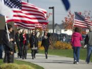 American flags lining the walkway greet people at the Armed Forces Reserve Center during 2013's Veterans Day Celebration.