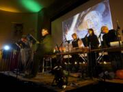 Photos by Steven Lane/The Columbian
The Willamette Radio Workshop performs the live radio show &quot;The War of the Worlds&quot; Thursday evening at the Kiggins Theatre in downtown Vancouver.